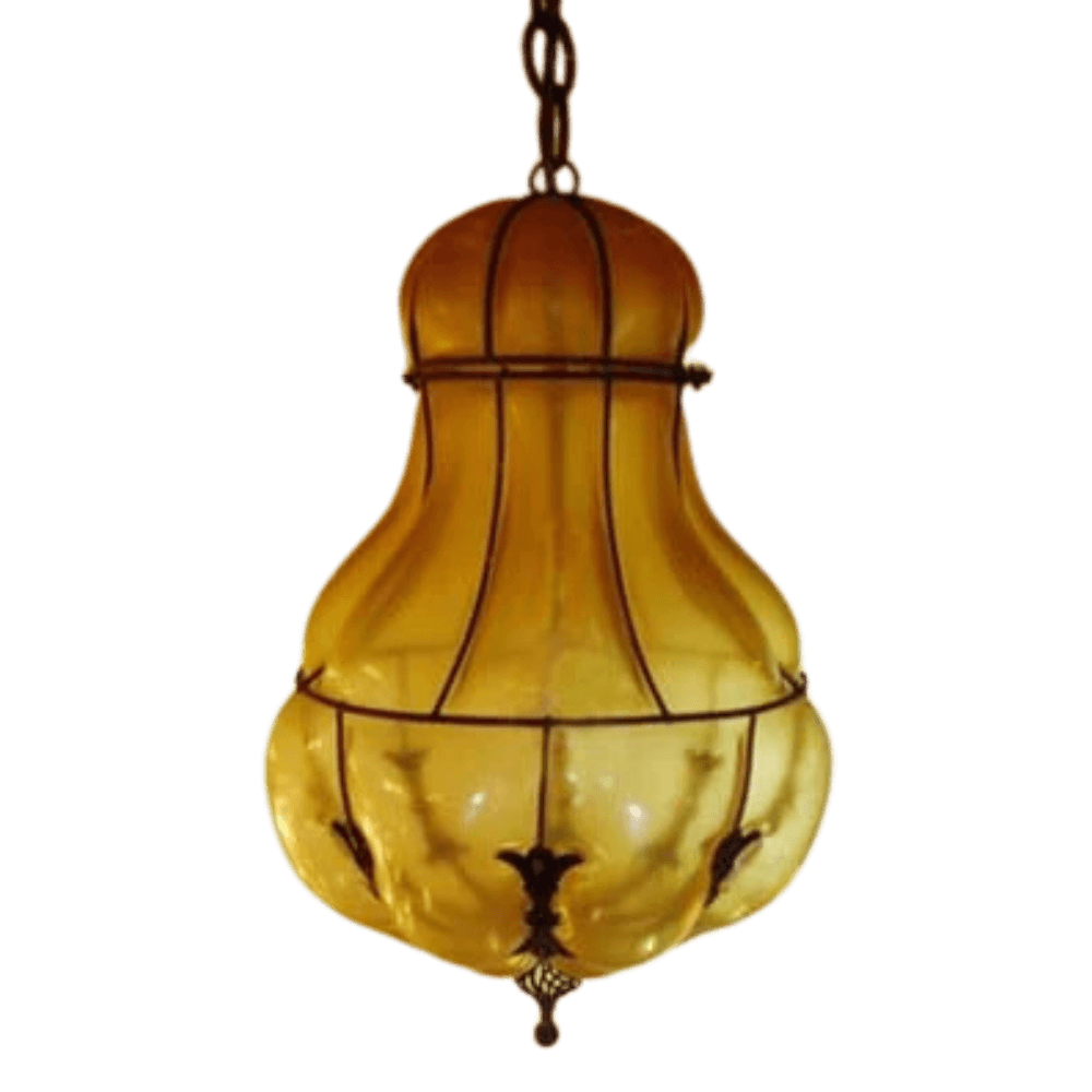 An elegant pendant light featuring a bulbous amber glass design, accented by intricate wrought iron detailing. Ideal for adding warmth and charm to any space.