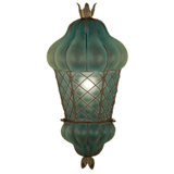 A decorative wall sconce featuring a soft green, textured glass shade, elegantly encased in intricate wrought iron detailing. The design showcases a distinctive rounded shape with a crown-like top, blending classic artistry with functional lighting. Perfect for adding a touch of charm and warmth to any space.