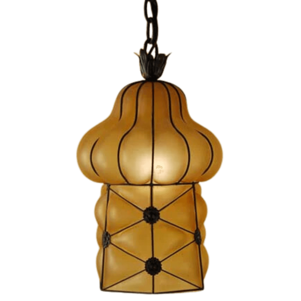 A beautifully crafted pendant light featuring an elegant, sculptural shape with a warm amber finish. The fixture is framed in intricate wrought iron, showcasing floral accents and a textured design, perfect for adding a touch of charm and sophistication to any space.