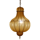 A beautifully crafted pendant light featuring a rounded, bulbous shape with elegant vertical lines. The warm, translucent shade emits a soft glow, complemented by decorative black accents. Perfect for adding a touch of sophistication to any space.