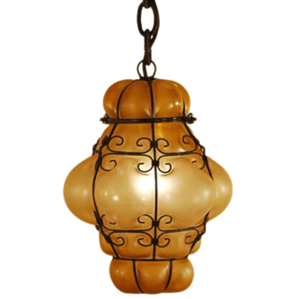 An intricately designed pendant light featuring a curvy, amber glass shade wrapped in elegant wrought iron detailing, perfect for adding warmth and character to any space.