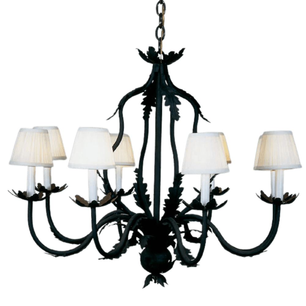 Elegant wrought iron chandelier featuring six arms adorned with decorative leaf motifs and soft, white fabric shades. The design combines traditional craftsmanship with timeless style, creating a warm ambiance. Perfect for dining areas or living spaces.