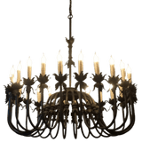 An elegant wrought iron chandelier featuring a curved, floral design with multiple candle-like bulbs. Its intricate details and warm illumination create a charming atmosphere, making it a stunning focal point for any space.