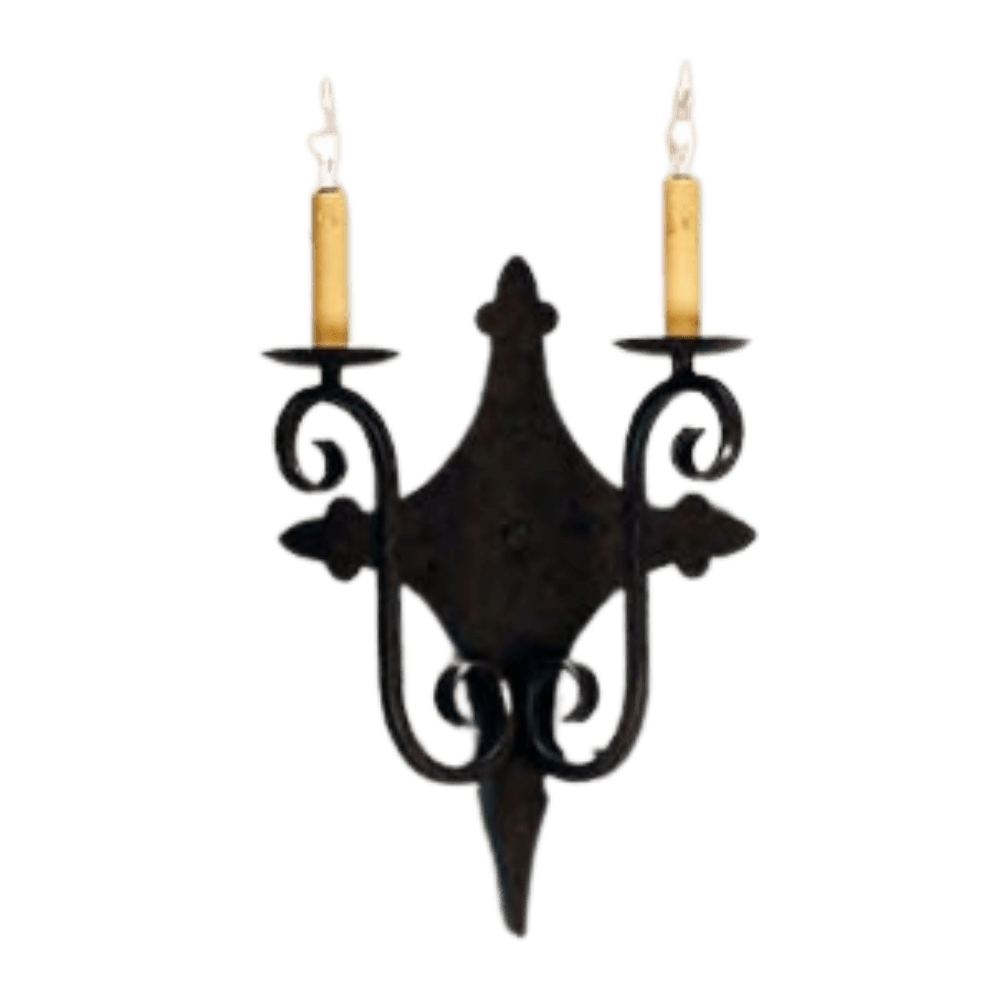 A decorative wrought iron sconce featuring two candle-style lights with warm yellow shades. The intricate design showcases elegant curves and details, perfect for adding a touch of charm to any space.