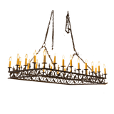 A large, ornate wrought iron chandelier featuring intricate scrollwork and multiple candle-like lights. The design showcases a rustic elegance, ideal for enhancing any space with a warm, inviting glow.