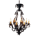 Elegant wrought iron chandelier featuring intricate scrollwork and six candle-like lights, exuding a warm, inviting ambiance. Perfect for enhancing any dining area or foyer.