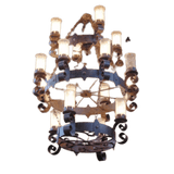 A decorative chandelier featuring elegant curves and intricate scrollwork. The fixture showcases multiple glass candle-like bulbs, exuding warmth and sophistication, perfect for enhancing any dining or living space.