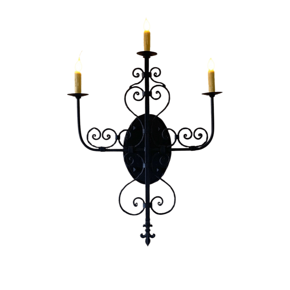 A black wrought iron sconce featuring intricate scrollwork and three candle holders, radiating elegance and charm in any space.