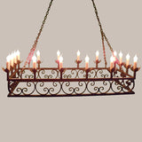 A stunning wrought iron chandelier featuring intricate scrollwork and multiple candle-style lights. Its elegant design adds a warm, inviting atmosphere to any space, suspended from a chain for a classic look.