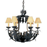 A decorative chandelier featuring intricate wrought iron work and elegant leaf motifs, complemented by softly tinted shades that create a warm glow.