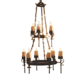 A large, ornate chandelier featuring multiple candle-style lights on elegant arms. The fixture showcases intricate wrought iron details and a rustic finish, creating a warm and inviting ambiance ideal for traditional or vintage-inspired interiors.