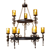 A beautifully crafted wrought iron chandelier featuring multiple golden candle-like lights. The intricate design showcases swirling details and a central circular frame, making it an elegant addition to any space.