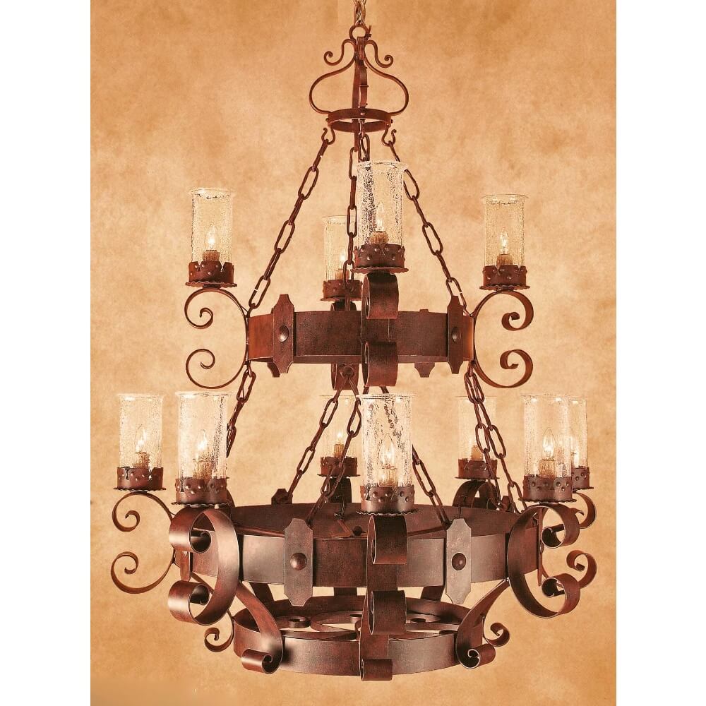 A decorative wrought iron chandelier featuring intricate scrollwork and a vintage finish. It holds several candle-style lights enclosed in glass shades, suspended by elegant chains, creating a warm and inviting ambiance.