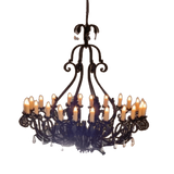 A large, intricately designed wrought iron chandelier featuring multiple elegantly arranged candle holders. The fixture has a classic, curvilinear shape with ornate detailing, creating a warm and inviting glow, ideal for enhancing any space.