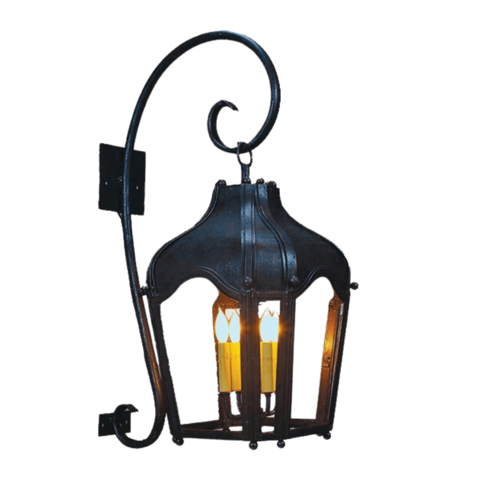 A decorative wall sconce featuring an elegant, curved design with a dark iron finish. It holds three candle-like bulbs, creating a warm glow, and is mounted against a wall, showcasing intricate detailing and craftsmanship.