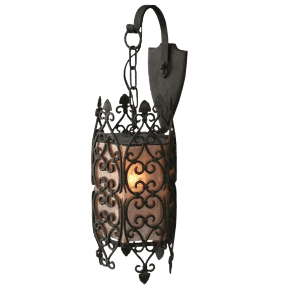 A decorative wrought iron sconce featuring intricate scrollwork and a warm, glowing inner light. The design showcases stylish curves and a classic aesthetic, perfect for enhancing any space with elegance.