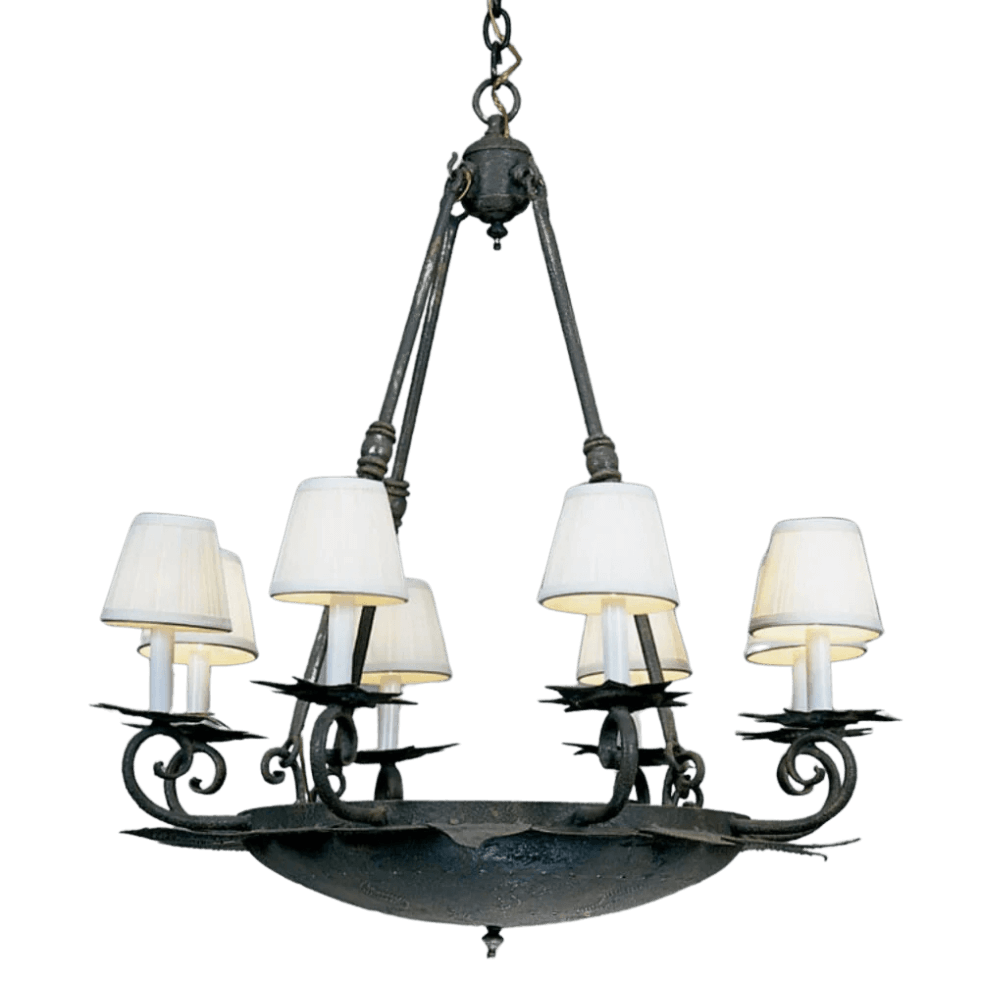 A beautifully crafted wrought iron chandelier featuring a central bowl design, elegantly adorned with five white fabric shades. The intricate scrollwork adds a touch of artistry while providing warm illumination, perfect for enhancing any space with a timeless charm.