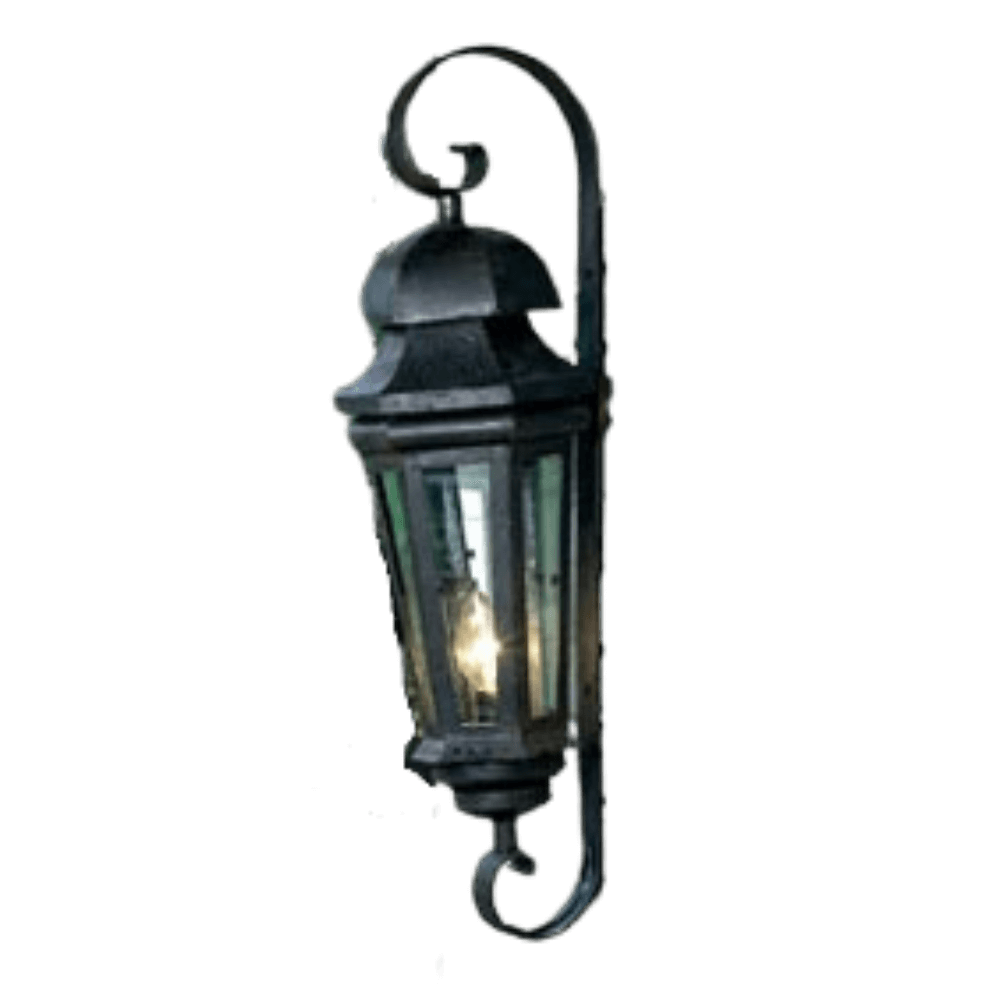 A wrought iron wall sconce featuring an elegant lantern design with glass panels. The fixture is adorned with a curling mount, providing a classic touch to any space.