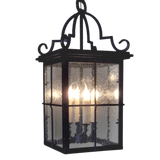 A decorative pendant light featuring a black wrought iron frame with intricate detailing. The clear panels showcase warm candle-style bulbs inside, providing an elegant glow. Designed to enhance both indoor and outdoor spaces.