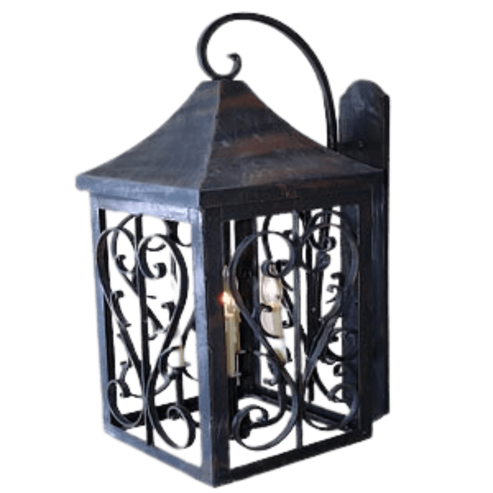 A decorative wall-mounted sconce featuring intricate wrought iron scrollwork. Its peaked top adds architectural interest, and it holds candle-like bulbs for warm illumination.