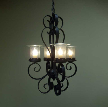 A beautifully crafted wrought iron pendant featuring an intricate scroll design and four glass lampshades. The warm light illuminates the space, adding an elegant touch to any room.