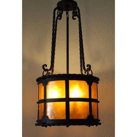 A beautifully crafted pendant featuring a round, amber glass shade held by intricately twisted metal arms. The wrought iron framework showcases a rustic design with a black finish, adding warmth and elegance to any space. Ideal for creating a cozy atmosphere.