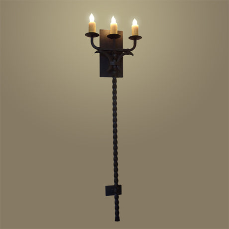 A decorative wall sconce featuring three elegant candle-style lights. Crafted from intricately twisted wrought iron, it showcases a sturdy base with a unique design, enhancing any room with its warm, inviting glow. Perfect for traditional or rustic décor.