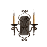 An elegant wrought iron wall sconce featuring intricate scrollwork and two candle-shaped lights. The design incorporates a dark finish with light-colored candle holders, creating a warm and inviting ambiance. Ideal for enhancing traditional or rustic decor.