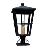 A decorative wrought iron sconce featuring a square shape with a pointed top, enclosing a candle-like light source. Intricate scrollwork base adds elegance to its sturdy design.