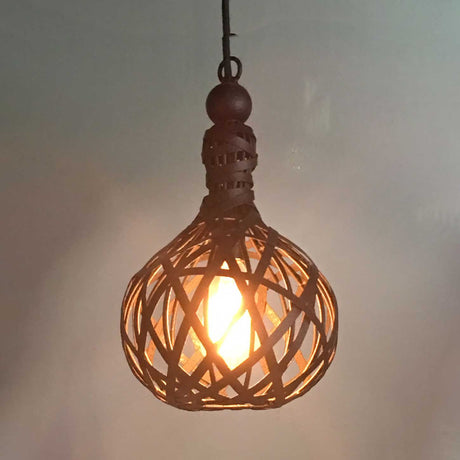 A beautifully crafted pendant light featuring an intricate woven design, showcasing a warm glow from the bulb inside.