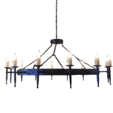 A large wrought iron chandelier featuring multiple candle-style lights. The design includes elegant arms and chains, creating a rustic yet refined ambiance.