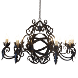 Intricately designed wrought iron chandelier featuring curved arms and decorative detailing, showcasing multiple candle-style bulbs for ambient lighting.