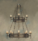 A beautifully crafted wrought iron chandelier featuring intricate scrollwork and multiple candle holders, elegantly suspended from a chain.