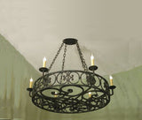 Elegant circular chandelier featuring intricate wrought iron scrollwork, adorned with multiple candle-like light fixtures, ideal for adding charm to any space.