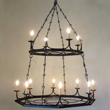 A two-tier chandelier featuring intricate wrought iron design with ten candle-style lights. The elegant curves and chains enhance its rustic charm, creating a warm ambiance ideal for dining or living spaces.