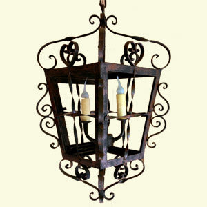 A decorative wrought iron chandelier featuring intricate swirling designs and a square frame. It holds three candle-like bulbs, enhancing any space with an elegant vintage charm.