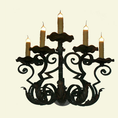 This wrought iron chandelier features a classic design with elegant curves and six candle-like bulbs. The intricate detailing showcases a blend of artistry and craftsmanship, creating a warm, inviting atmosphere. Perfect for adding a touch of sophistication to any space.