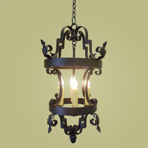 A beautifully crafted wrought iron pendant light featuring elegant scrollwork and decorative accents. The fixture has a candle-style bulb holder and exudes vintage charm, perfect for enhancing any space with warmth and style.