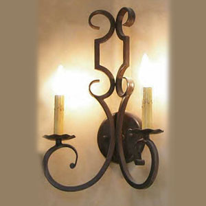 A beautifully crafted wrought iron sconce featuring elegant curves and two candle-style lights, complementing any rustic or vintage decor.