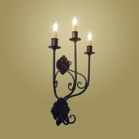 Elegant wrought iron sconce featuring three candle-style lights, intricate scrollwork, and a decorative back plate, enhancing any space with warm illumination.