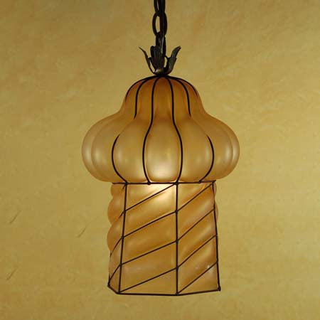 A decorative pendant light featuring a curvy, frosted glass shade with a distinctive ribbed design, enclosed in elegant wrought iron detailing. The soft, warm hues create a welcoming ambiance, perfect for enhancing various interior spaces.