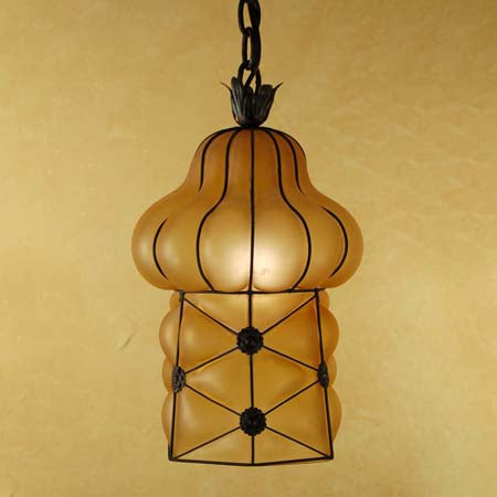 A decorative pendant light featuring an ornate, curvaceous design made of wrought iron and frosted glass. The fixture has a unique shape resembling a gourd, accented by floral motifs. Ideal for adding warmth and elegance to any space.