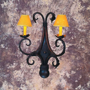 A decorative wall sconce featuring a dark wrought iron frame with intricate scrollwork. It has two yellow shade lamps that add a warm glow, perfect for enhancing any room's ambiance.