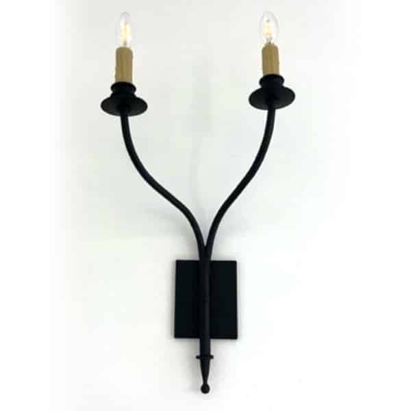 A stylish black wrought iron sconce featuring two candle-like bulbs. The elegant design includes curving arms and a square backplate, adding a touch of sophistication to any space.