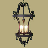 Elegant wrought iron chandelier featuring intricate scrollwork and a tiered design. It holds four lights, casting a warm glow, perfect for enhancing any space.